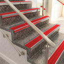 Raked back aluminium stair nosing, polished aluminium with poppy castellated insert