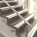 Raked back aluminium stair nosing, polished aluminium with porth stone smooth textured insert
