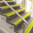 Raked back aluminium stair nosing, polished aluminium with yellow castellated insert