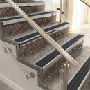 Raked back aluminium stair nosing, satin aluminium with black castellated insert