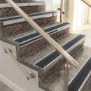 Raked back aluminium stair nosing, satin aluminium with black olympic grip insert