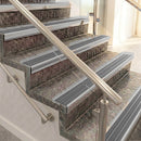 Raked back aluminium stair nosing, satin aluminium with flint castellated insert