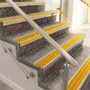 Raked back aluminium stair nosing, satin aluminium with gold castellated insert