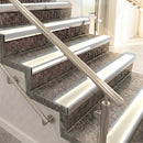 Raked back aluminium stair nosing, satin aluminium with porth stone smooth textured insert