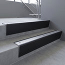 Black Anodised raked back aluminium stair nosing 62x55mm with Mill Aluminium infill, fitted to a concrete step