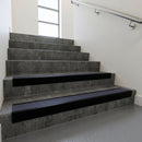 Black Anodised raked back aluminium stair nosing 62x55mm with Regency Castellated infill, fitted to a concrete step