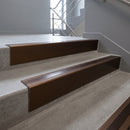 Bronze raked back aluminium stair nosing 62x55mm with Bronze Aluminium infill, fitted to a concrete step