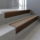 Bronze raked back aluminium stair nosing 62x55mm with Fawn Castellated infill, fitted to a concrete step