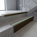 Bronze raked back aluminium stair nosing 62x55mm with Jade Castellated infill, fitted to a concrete step