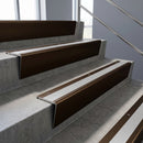 Bronze raked back aluminium stair nosing 62x55mm with Mill Aluminium infill, fitted to a concrete step