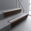 Bronze raked back aluminium stair nosing 62x55mm with Nimbus Castellated infill, fitted to a concrete step