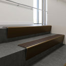 Bronze raked back aluminium stair nosing 62x55mm with Peat Castellated infill, fitted to a concrete step