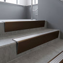 Bronze raked back aluminium stair nosing 62x55mm with Polished Aluminium infill, fitted to a concrete step