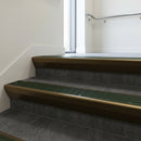 Bronze raked back aluminium stair nosing 62x55mm with Spruce Castellated infill, fitted to a concrete step