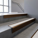 Bronze raked back aluminium stair nosing 62x55mm with White Castellated infill, fitted to a concrete step