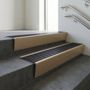 Light Bronze raked back aluminium stair nosing 62x55mm with Black Castellated infill, fitted to a concrete step