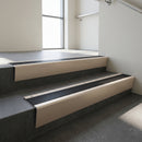 Light Bronze raked back aluminium stair nosing 62x55mm with Black Smooth Textured infill, fitted to a concrete step