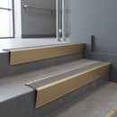 Light Bronze raked back aluminium stair nosing 62x55mm with Flint Castellated infill, fitted to a concrete step