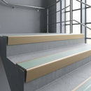 Light Bronze raked back aluminium stair nosing 62x55mm with Jade Castellated infill, fitted to a concrete step