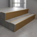 Light Bronze raked back aluminium stair nosing 62x55mm with Light Grey Smooth Textured infill, fitted to a concrete step