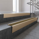 Light Bronze raked back aluminium stair nosing 62x55mm with Olive Castellated infill, fitted to a concrete step