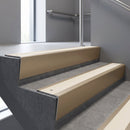 Light Bronze raked back aluminium stair nosing 62x55mm with Porth Stone Smooth Textured infill, fitted to a concrete step