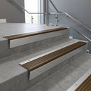 Mill Aluminium raked back aluminium stair nosing 62x55mm with Bronze Aluminium infill, fitted to a concrete step