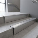 Mill Aluminium raked back aluminium stair nosing 62x55mm with Mill Aluminium infill, fitted to a concrete step