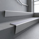 Mill Aluminium raked back aluminium stair nosing 62x55mm with Nimbus Castellated infill, fitted to a concrete step