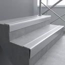 Mill Aluminium raked back aluminium stair nosing 62x55mm with Polar Grey Smooth Textured infill, fitted to a concrete step