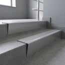 Mill Aluminium raked back aluminium stair nosing 62x55mm with Polished Aluminium infill, fitted to a concrete step