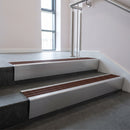 Mill Aluminium raked back aluminium stair nosing 62x55mm with Rustic Castellated infill, fitted to a concrete step