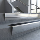 Polished Aluminium raked back aluminium stair nosing 62x55mm with Black Anodised Aluminium infill, fitted to a concrete step