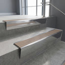 Polished Aluminium raked back aluminium stair nosing 62x55mm with Fawn Castellated infill, fitted to a concrete step