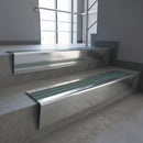 Polished Aluminium raked back aluminium stair nosing 62x55mm with Jade Castellated infill, fitted to a concrete step