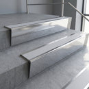 Polished Aluminium raked back aluminium stair nosing 62x55mm with Polar Grey Smooth Textured infill, fitted to a concrete step