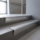 Polished Aluminium raked back aluminium stair nosing 62x55mm with Polished Aluminium infill, fitted to a concrete step