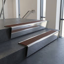 Polished Aluminium raked back aluminium stair nosing 62x55mm with Rustic Castellated infill, fitted to a concrete step