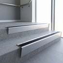 Satin Aluminium raked back aluminium stair nosing 62x55mm with Black Anodised Aluminium infill, fitted to a concrete step