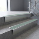 Satin Aluminium raked back aluminium stair nosing 62x55mm with Jade Castellated infill, fitted to a concrete step