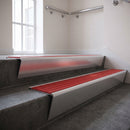 Satin Aluminium raked back aluminium stair nosing 62x55mm with Poppy Castellated infill, fitted to a concrete step