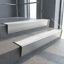 Satin Aluminium raked back aluminium stair nosing 62x55mm with White Castellated infill, fitted to a concrete step