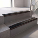 Square edge with ramped back aluminium stair nosing, 70mm tread, coal (black) exterior grip insert, dark bronze finish