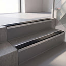 Square edge with ramped back aluminium stair nosing, 70mm tread, coal (black) exterior grip insert, mill finish finish