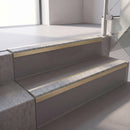 Square edge with ramped back aluminium stair nosing, 70mm tread, everest (light grey) exterior grip insert, satin gold finish
