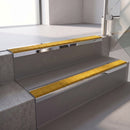 Square edge with ramped back aluminium stair nosing, 70mm tread, solar (golden yellow) Mor Grip insert, bright polished finish