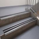 Square edge with ramped back aluminium stair nosing, 93mm tread, obsidian (dark charcoal) Mor Grip insert, mill finish finish