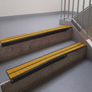 Square edge with ramped back aluminium stair nosing, 93mm tread, solar (golden yellow) Mor Grip insert, satin black finish
