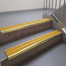 Square edge with ramped back aluminium stair nosing, 93mm tread, solar (golden yellow) Mor Grip insert, satin gold finish