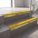 Square edge with ramped back aluminium stair nosing, 70mm tread, brimstone (safety yellow) exterior grip insert, mirrorflect gold finish